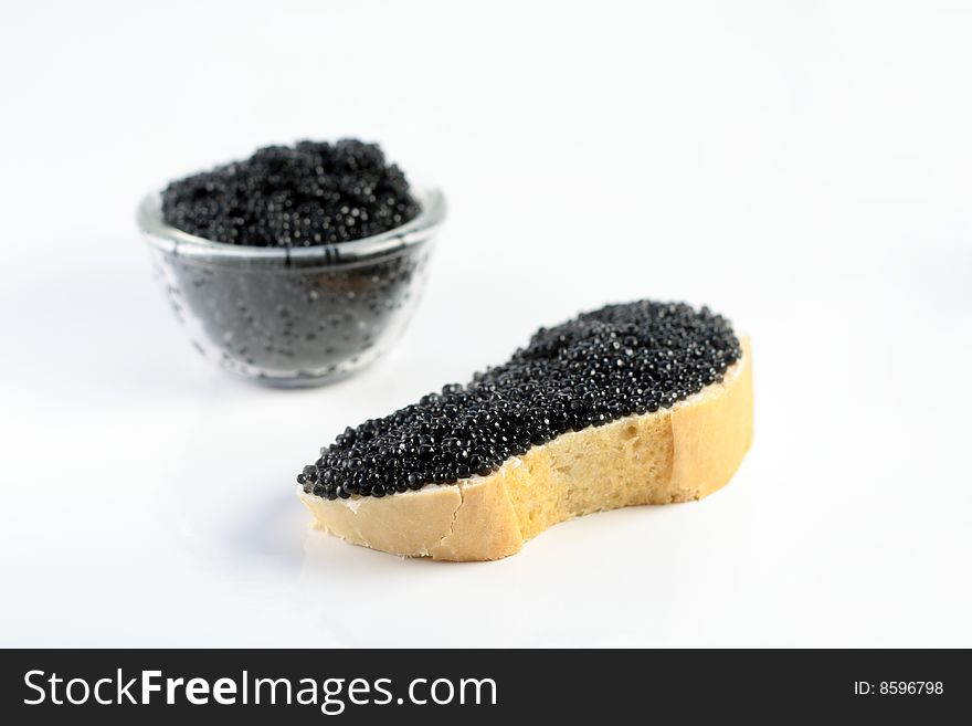 Soft black caviar with bread and butter