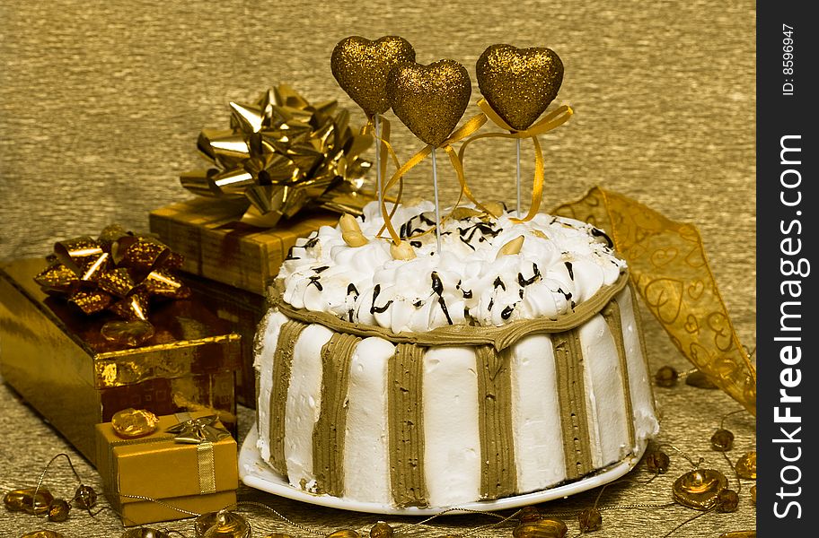 Cake with golden valentine hearts. Cake with golden valentine hearts