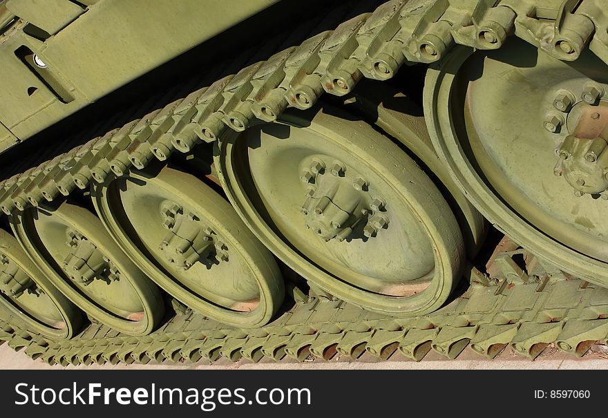 Close up view of the wheels and tracks on a Howitzer, that has been restored and sits on display in a city park in Great Bend Kansas. Close up view of the wheels and tracks on a Howitzer, that has been restored and sits on display in a city park in Great Bend Kansas.