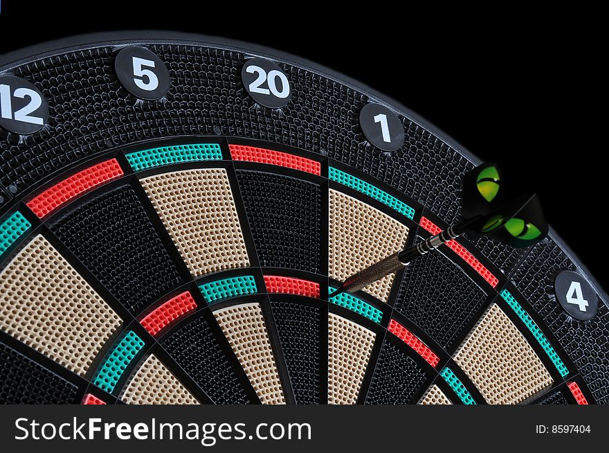 Darts board with one dart stuck. Darts board with one dart stuck