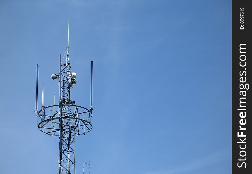 Communication tower in the blue sky