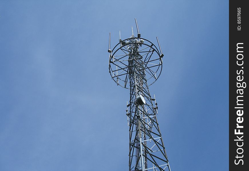 Communication tower in the blue sky