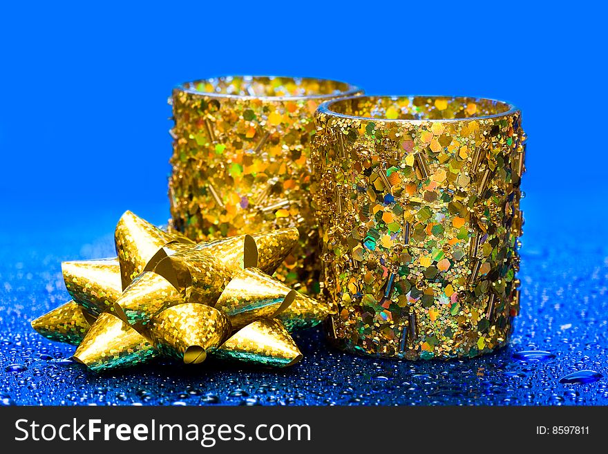 Golden candles on blue background