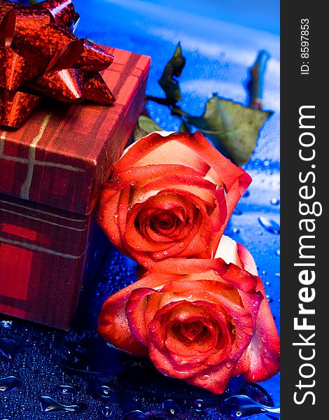 Gift box and red roses. Gift box and red roses