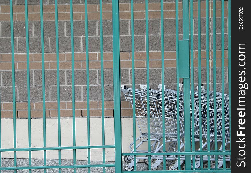 Shopping carts behind a fence