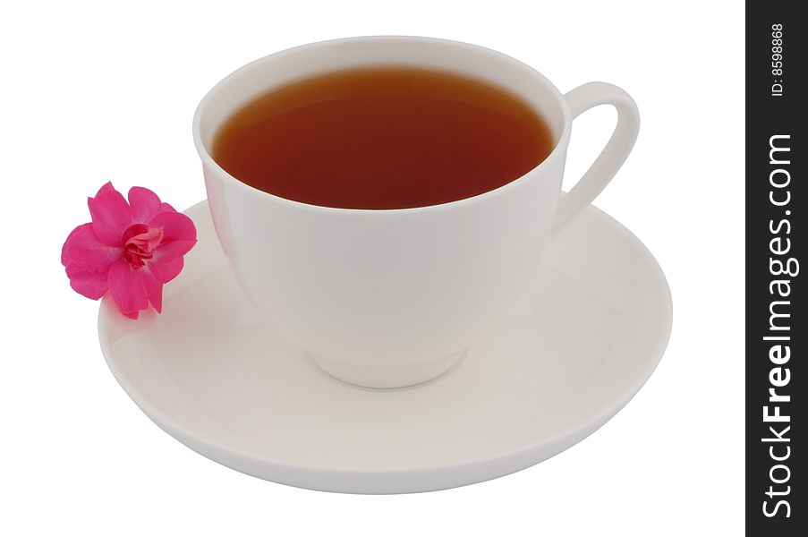 Cup of black tea with pink flower isolated on white