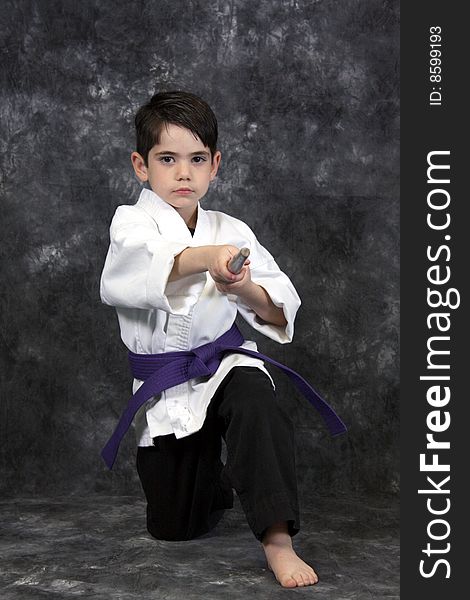 Martial Arts Boy Holding Bow