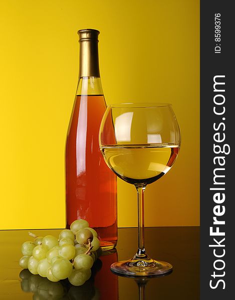 Bottle and glass of wine with grapes. Bottle and glass of wine with grapes