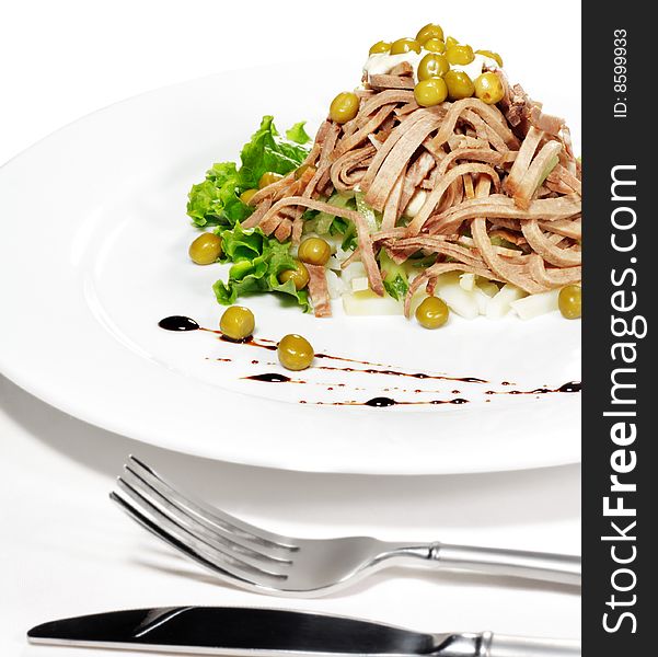 Green Peas and Meat Salad Served with Salad Leaves and Sauce. Isolated on White Background