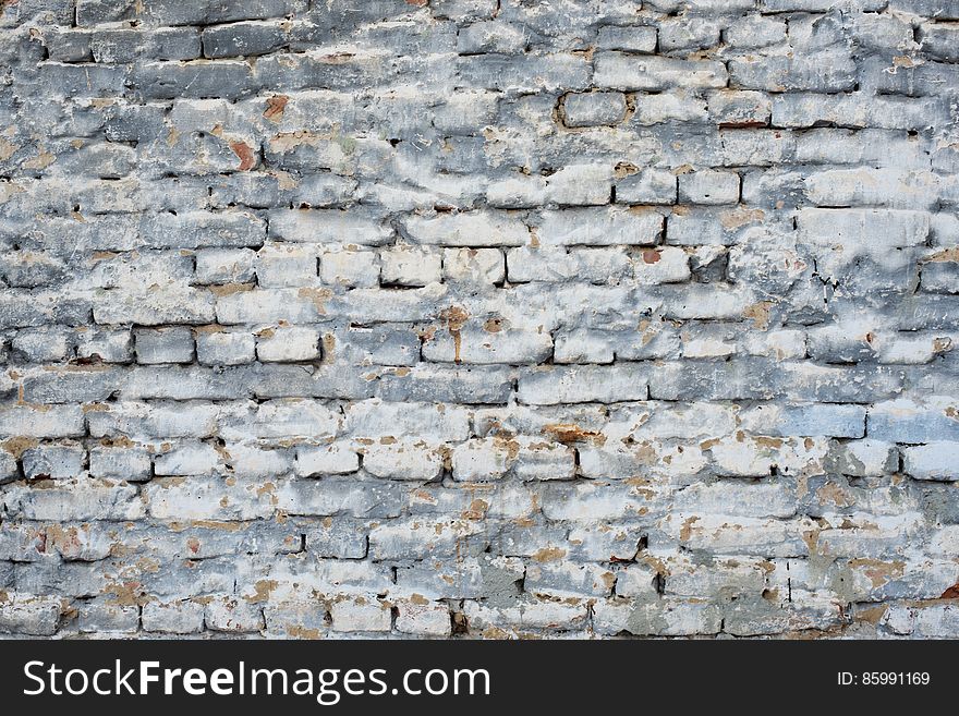 Fragment Of Old Brick Wall With White Gray And Blue Colors