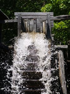 Rushing Water Wheel Stock Image