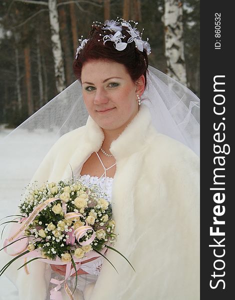 Portrait of the bride with wedding bouquet