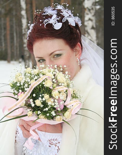 Portrait of the bride with wedding bouquet