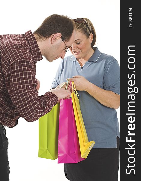 Couple with shopping bags over white background