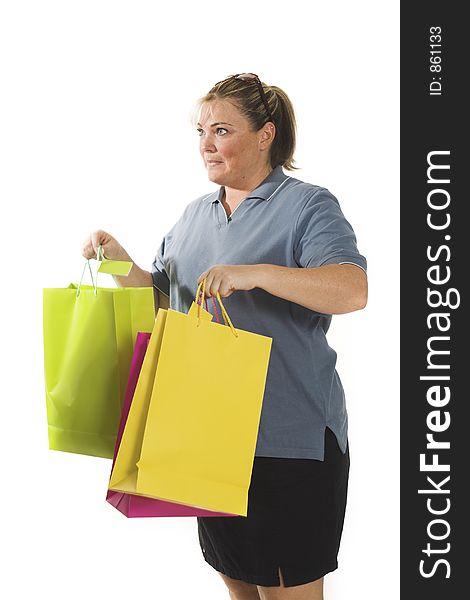 Woman holding bags over white