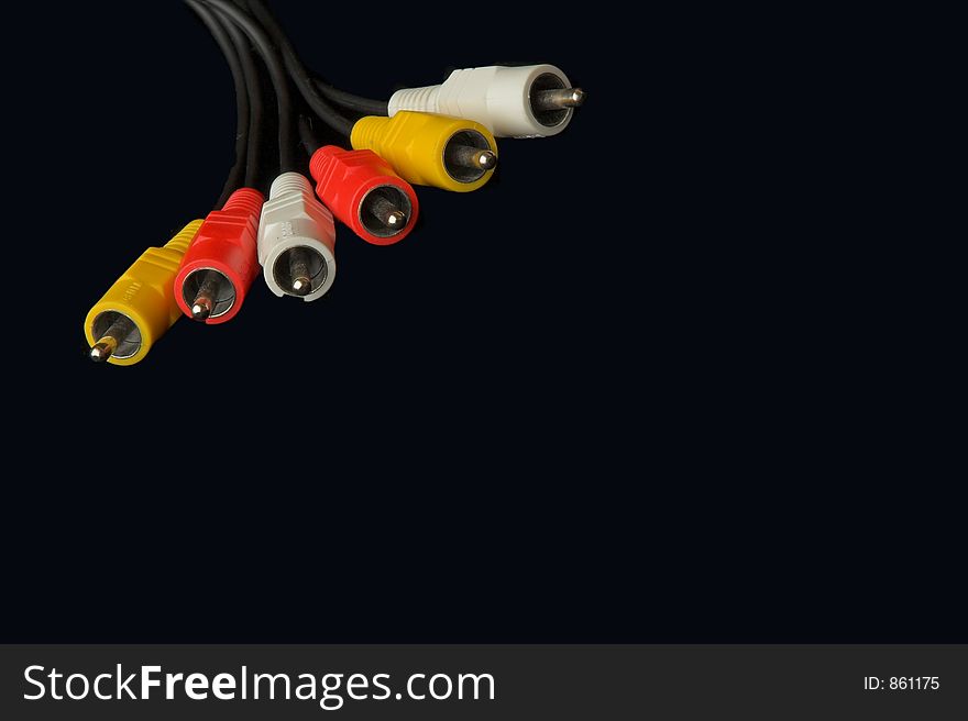 Colored audio video connectors on black. Colored audio video connectors on black