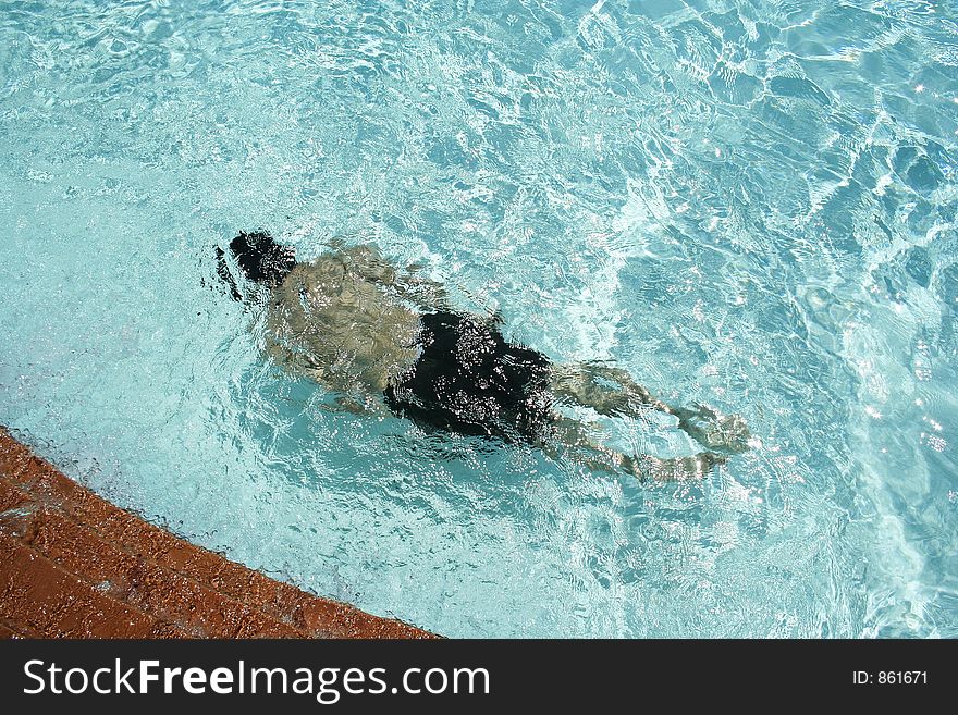 A man swimming and diving under the water. A man swimming and diving under the water