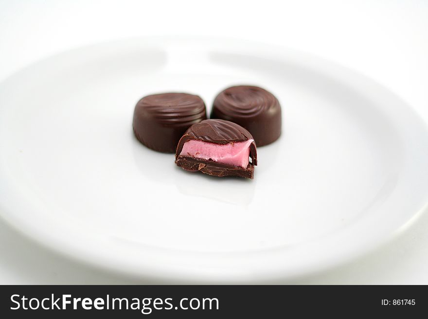 Chocolate candy on a white background with shallow DOF. Chocolate candy on a white background with shallow DOF