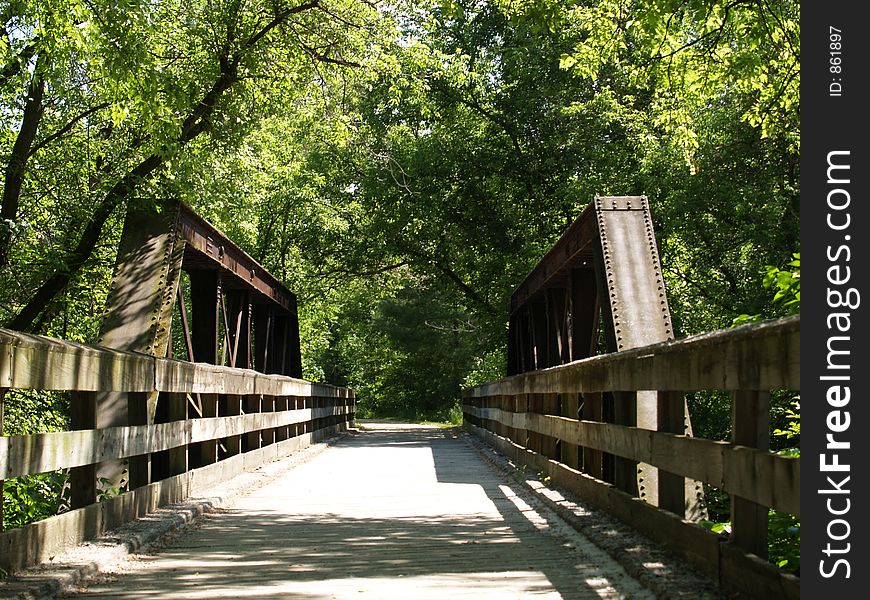 Bridge through a nature trail. Bridge through a nature trail