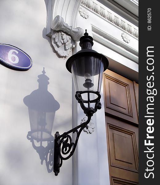 A street lantern on one of ancient houses in Moscow. A street lantern on one of ancient houses in Moscow