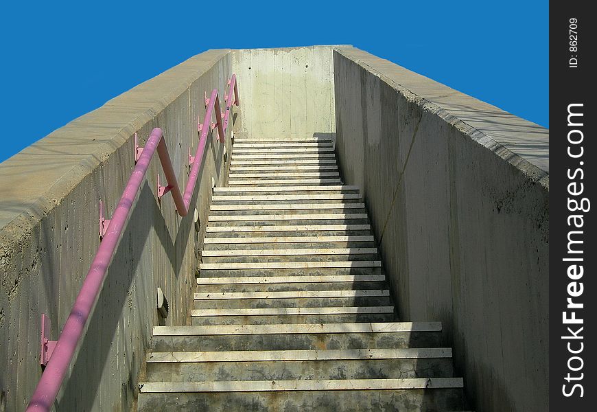 Concrete stairs ascending to a blue sky. Concrete stairs ascending to a blue sky