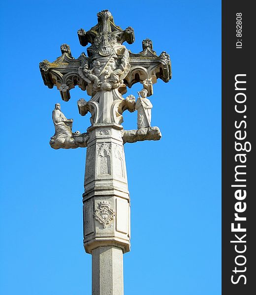 Stone cross over a blue sky
