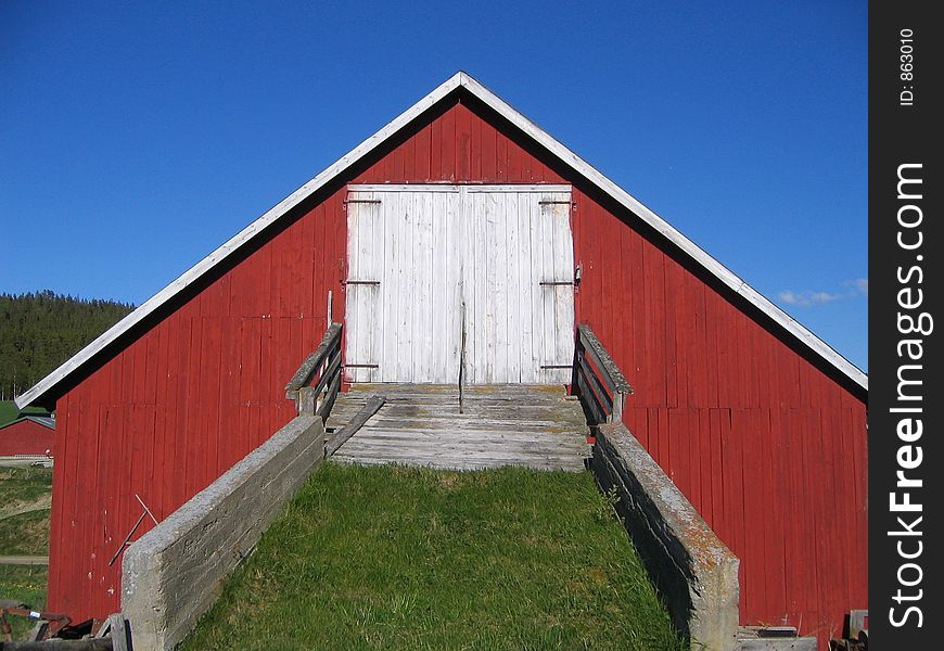 Norwegian dairy barn with bridge to drive in the hay. Norwegian dairy barn with bridge to drive in the hay