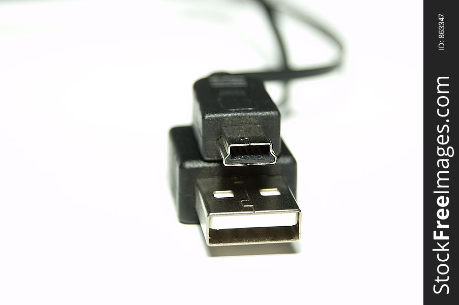 Black USB Cable over white background
Shallow Depth of field