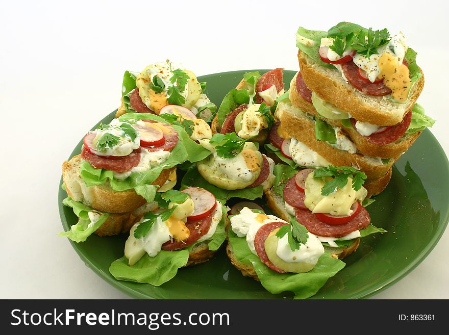 Fresh spring time sandwiches put together on plate. Fresh spring time sandwiches put together on plate