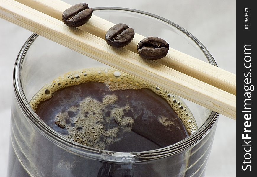 Glass of coffee and chopsticks. Glass of coffee and chopsticks