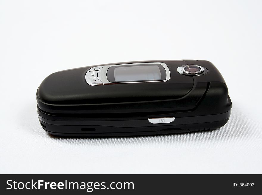 Black cell phone on white background with photo camera. Black cell phone on white background with photo camera