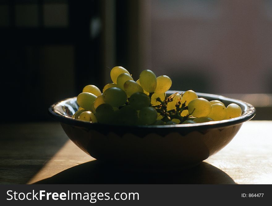 Bowl of grapes in afternoon light--film scan