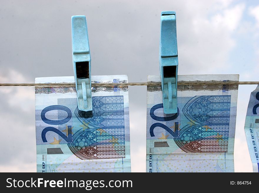 Twenty euros in  hanging on a clothes line drying