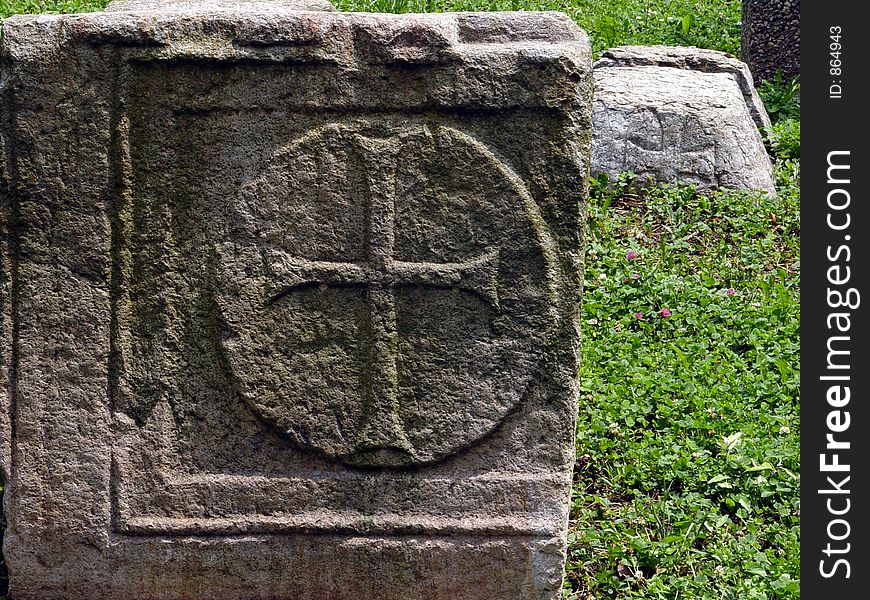 Cross relief on old stone.