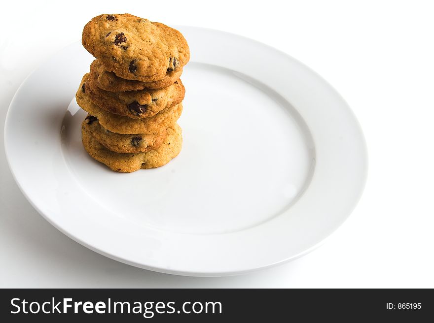 Stack of homemade chocolate chip cookies on white plate. Stack of homemade chocolate chip cookies on white plate