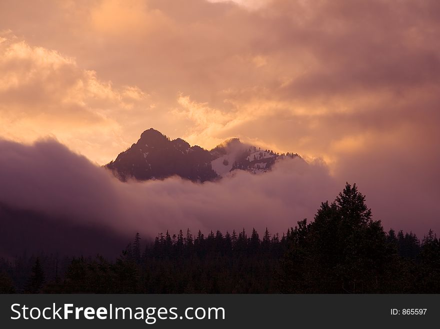 Cloudy mountaintops at sunrise. Cloudy mountaintops at sunrise