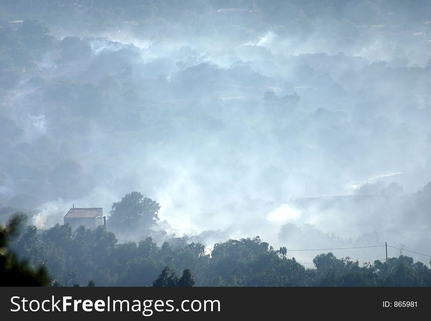 Fire in the corsican mountains: a plane is throwing water on the fire. Fire in the corsican mountains: a plane is throwing water on the fire