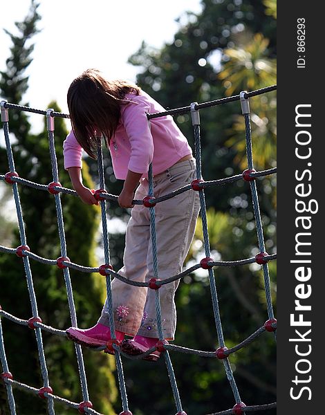 Girl playing on a playground