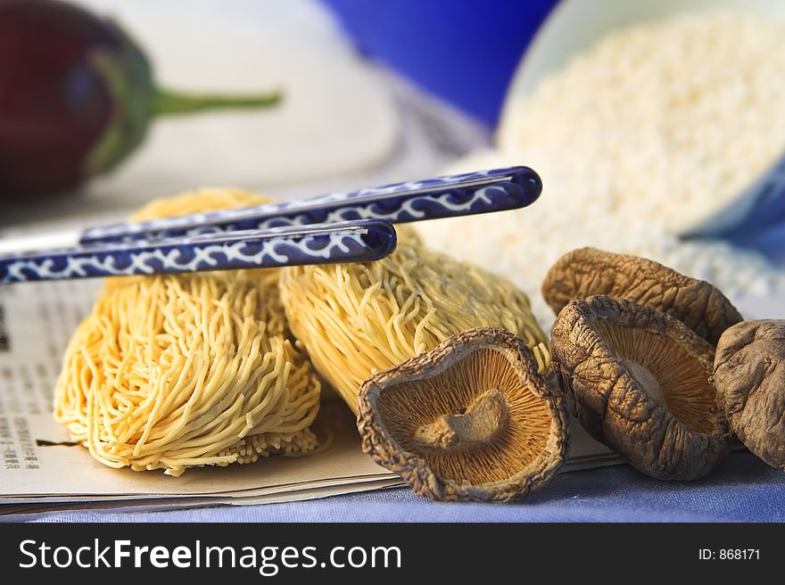 Asian noodles,shitake mushrooms and chopsticks. Asian noodles,shitake mushrooms and chopsticks