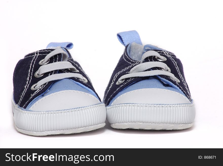 Pair of baby sneakers over white