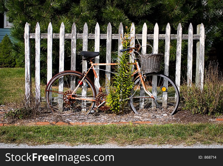 Vintage Bicycle By Fence