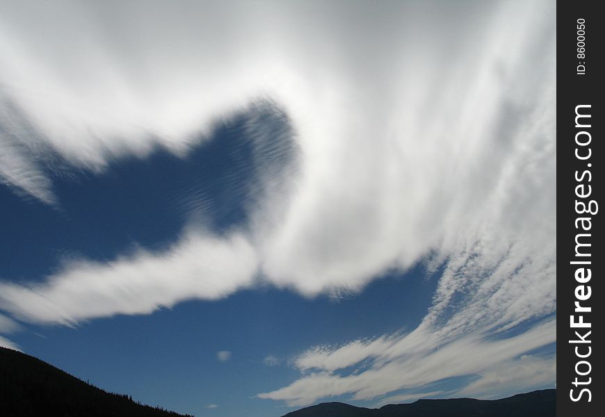 White moving clouds in the blue sky