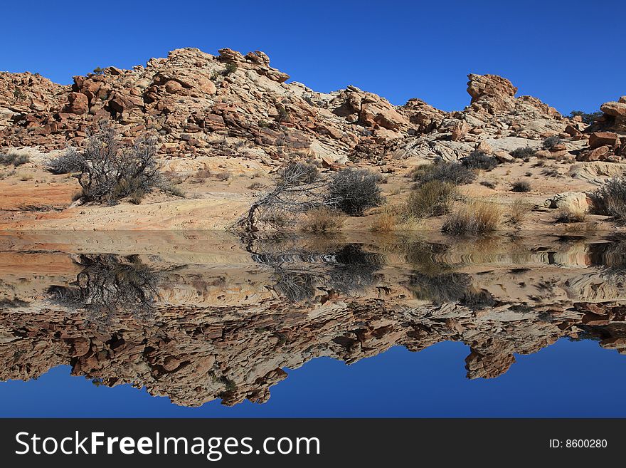 View of red rock formations in San Rafael Swell with blue skyï¿½s. View of red rock formations in San Rafael Swell with blue skyï¿½s