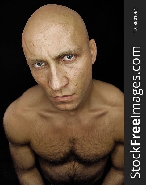 A baldhead man with hairy chest