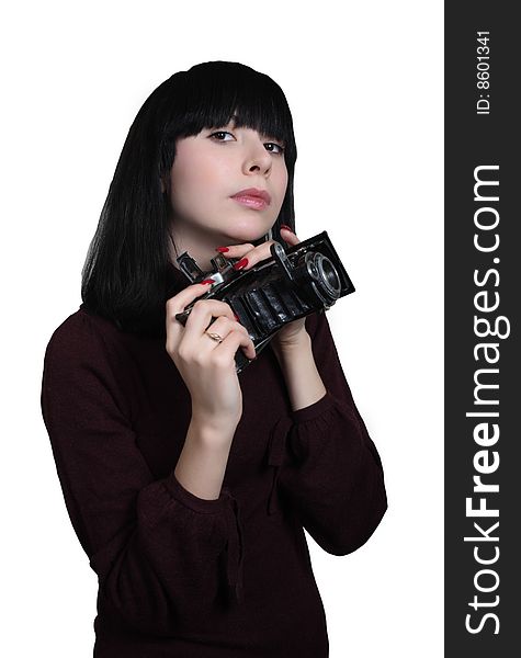 Young girl holding old film camera. Young girl holding old film camera