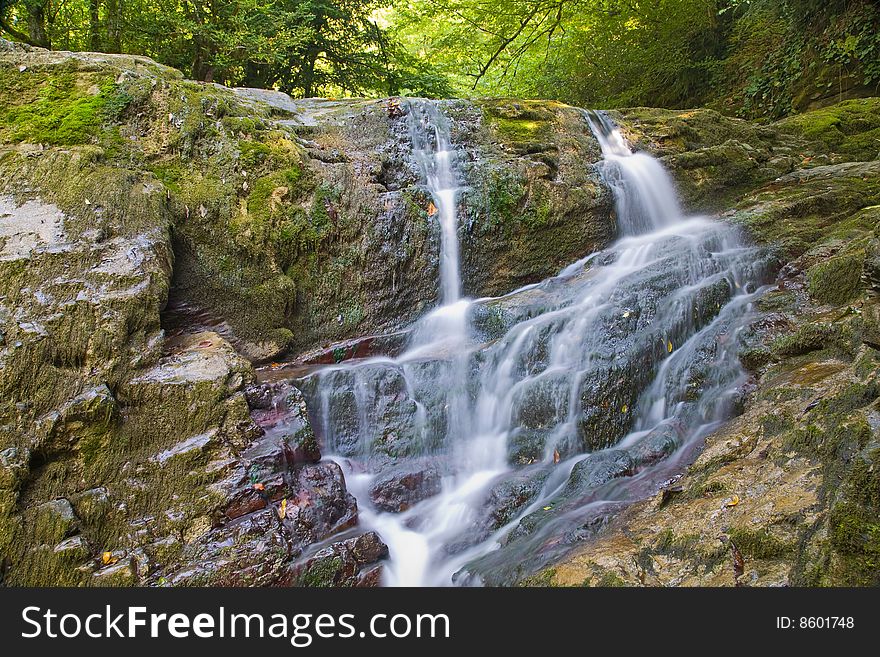 Beautiful waterfall in green summer forst. Beautiful waterfall in green summer forst