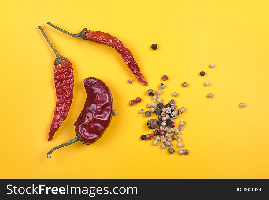 Dry red chili paprika and pepper on yellow background. Dry red chili paprika and pepper on yellow background