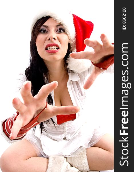 Beautiful woman with christmas hat giving bad expression on an isolated background