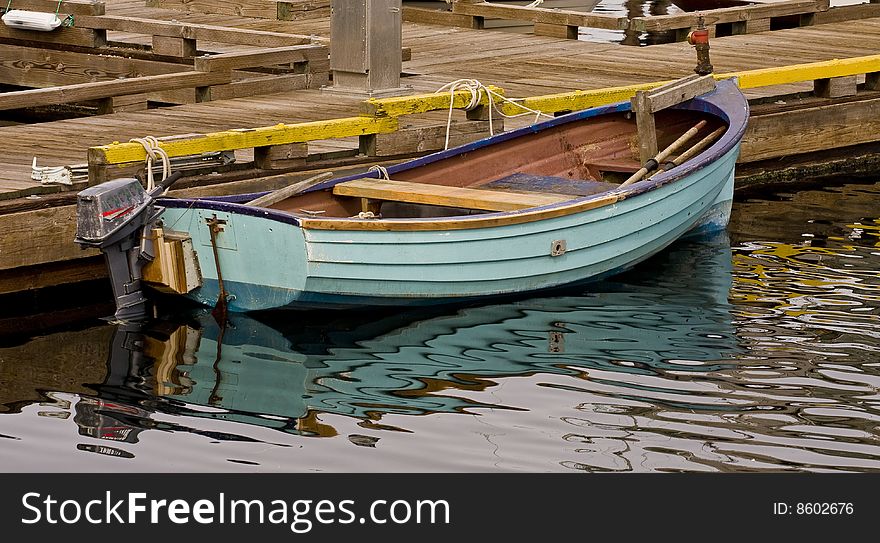 Small Blue Boat at a Pier