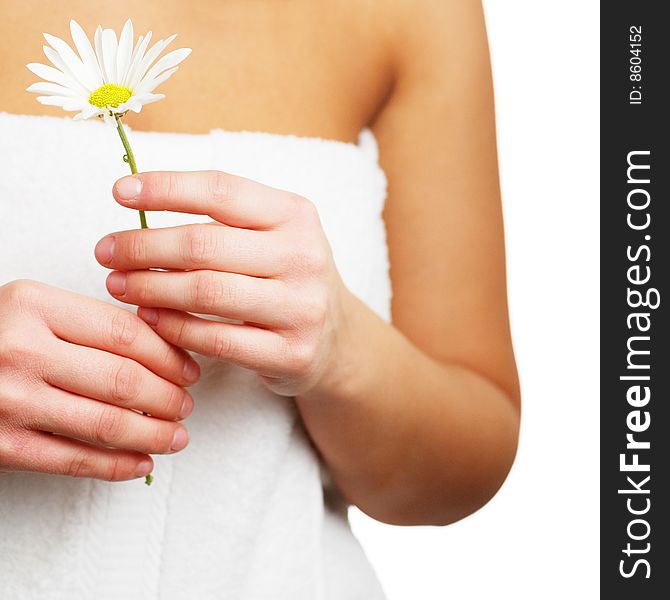 Close up of a spa woman holding a flower. Close up of a spa woman holding a flower.